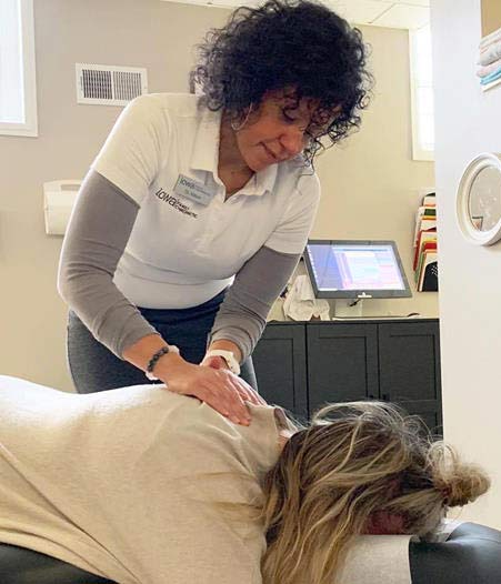 Chiropractor Adjusting Patient